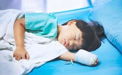 asian child in hospital bed