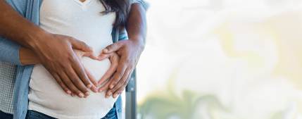 Pregnant mother with heart hands