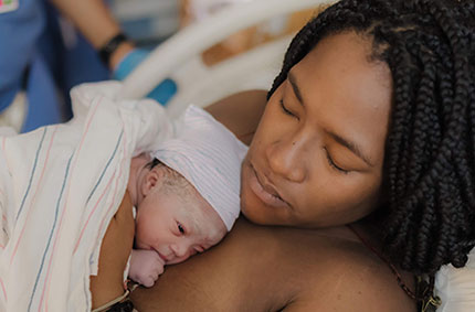 Baby resting on mother's chest