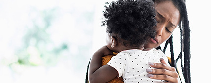 Woman holding child