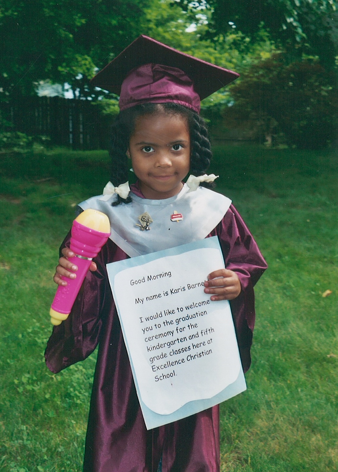 Nicole's daughter in her kindergarten graduation robe.